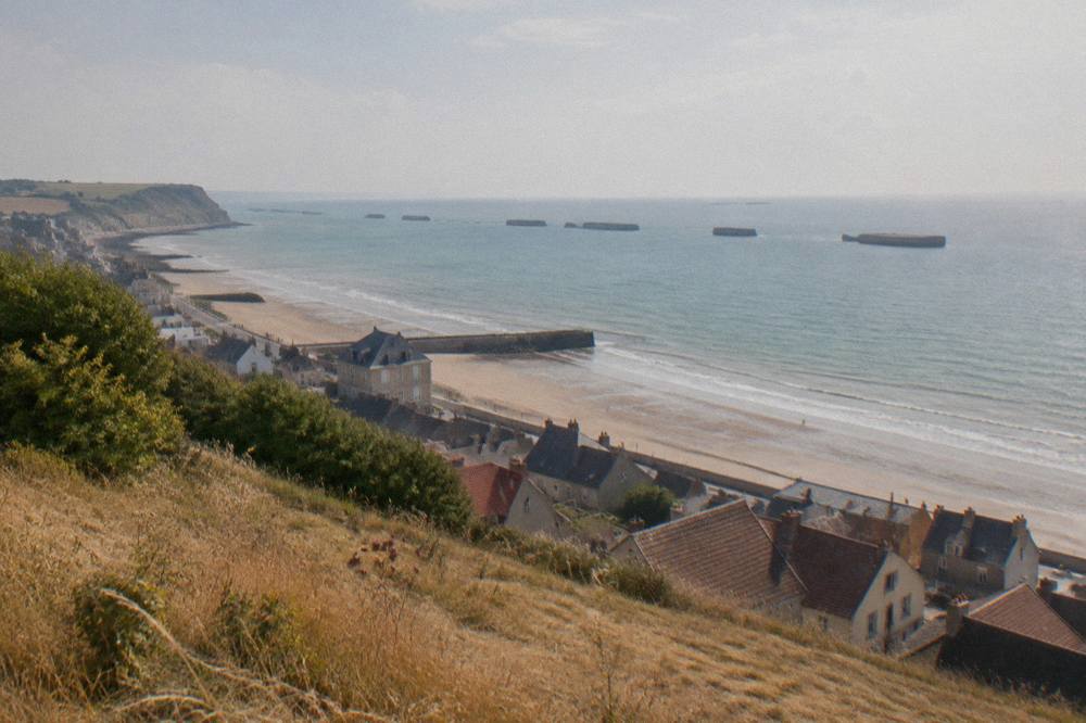 View over Arromanches bay with Mulberry harbour caissons visible in the water