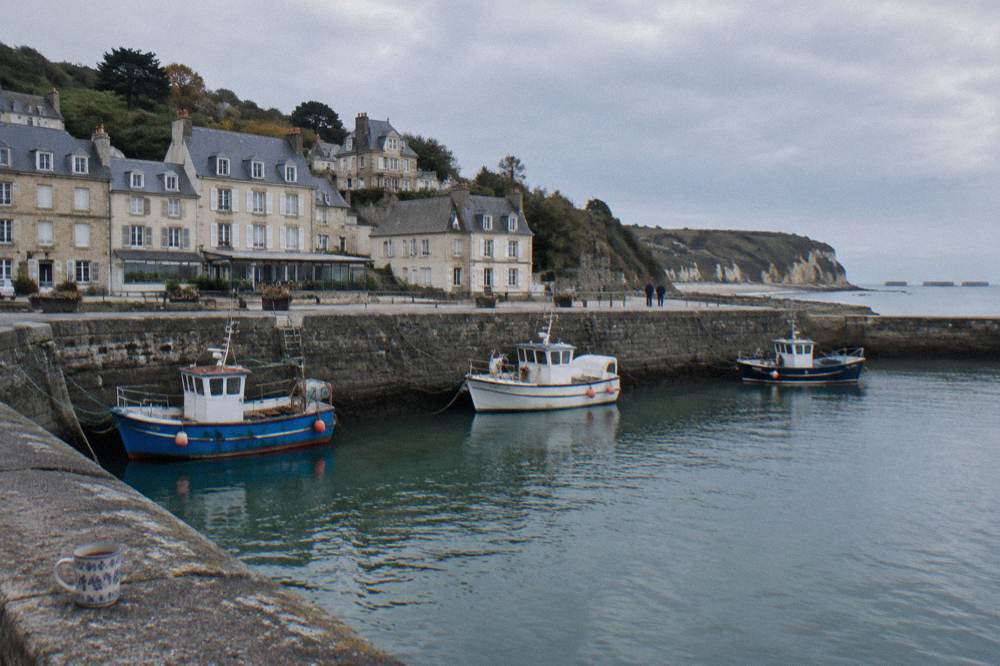 Harbor waterfront in Cherbourg with boats moored along the quay