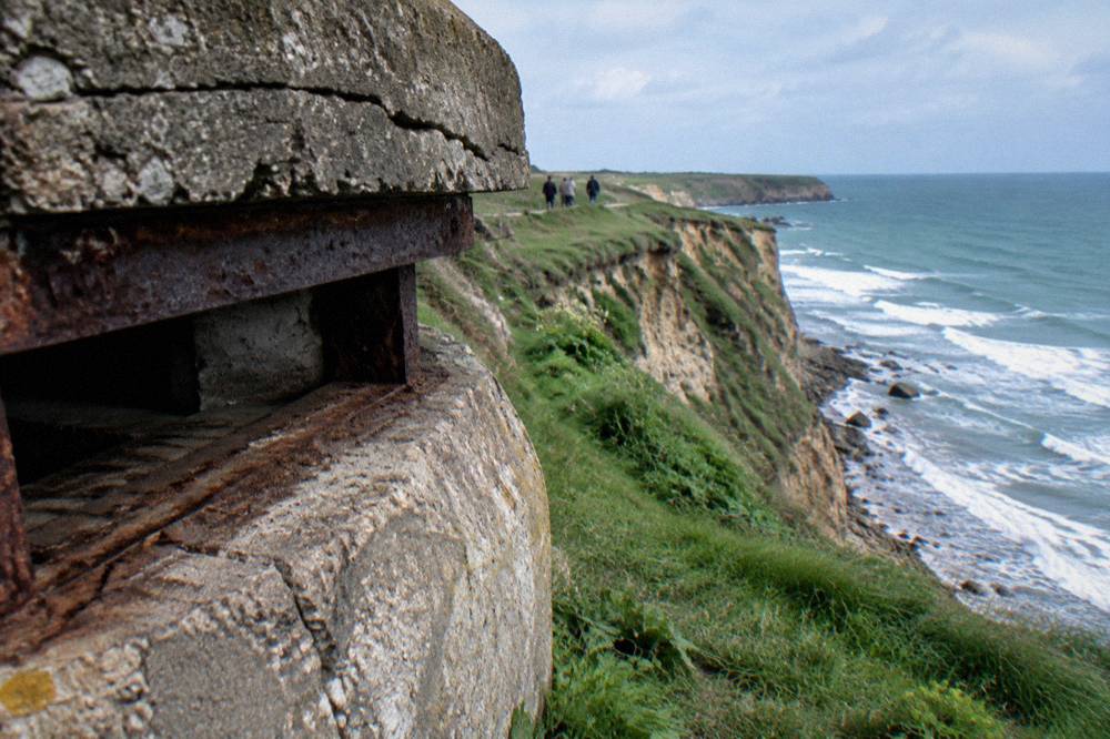 Concrete observation bunker on the clifftop at Pointe du Hoc above the English Channel